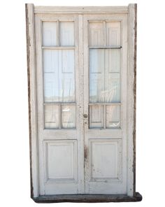 Puerta de madera cedro con postigos